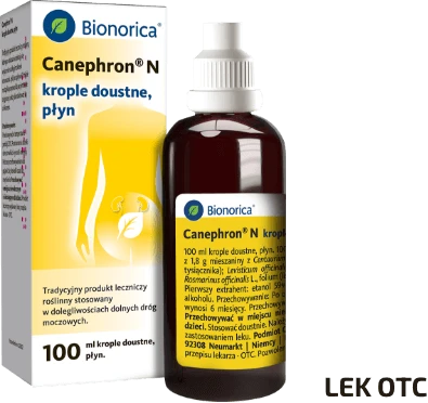 Ciemnobrązowa butelka kropli doustnych Canephron N - 100 ml; żółto-białe opakowanie obok; napis Lek OTC